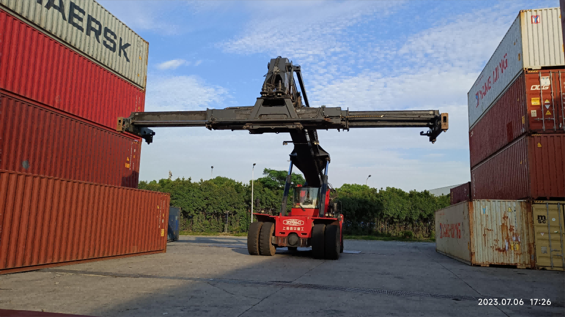 A red container handler car