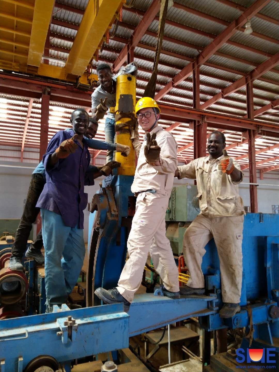 Group photo of SME worker and local worker with large smile on their faces