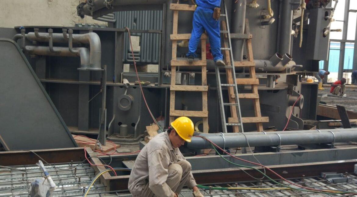 SME workers are installing the electric arc furnace for Nigeria steelmaking project