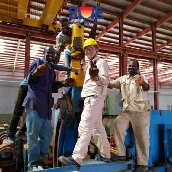 A young SME Worker took photo with local workers near the rolling mill, showing the friendship between the two partners.